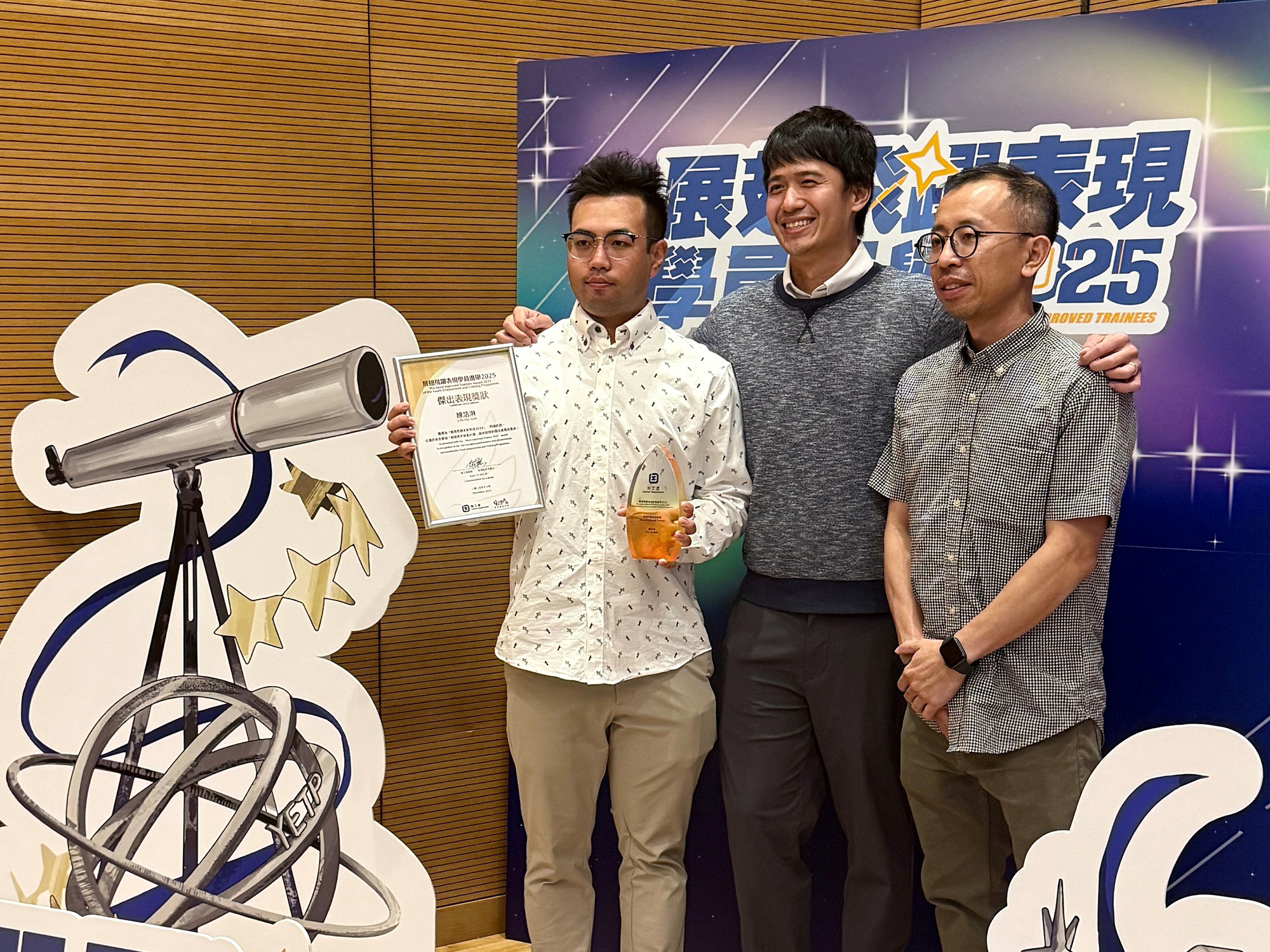 Awardees with guests, family and friends, employers and service providers taking photos together