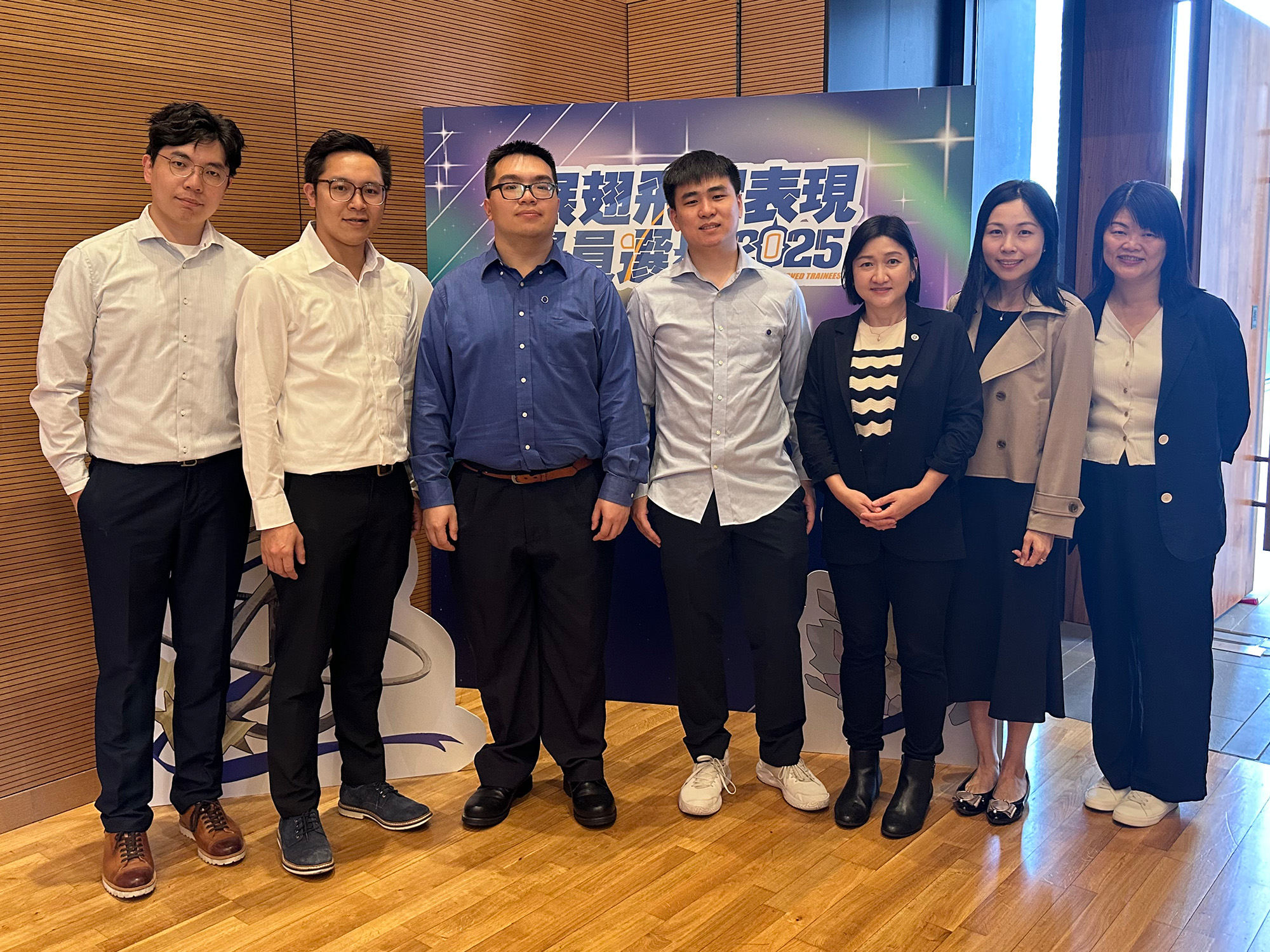 Awardees with guests, family and friends, employers and service providers taking photos together